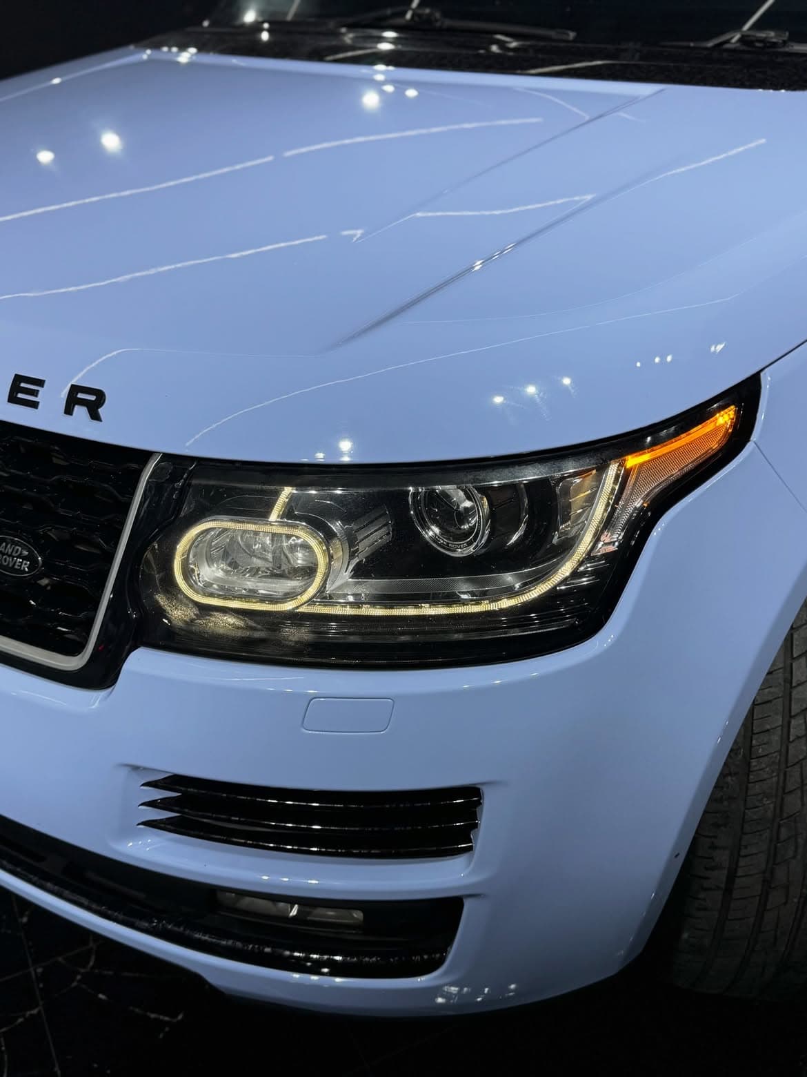 Range Rover Mist Blue wrap — headlight detail